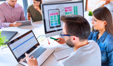 Web designers work together to create an online business presence