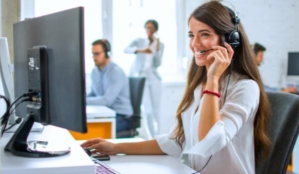 An IT technician assists an end user